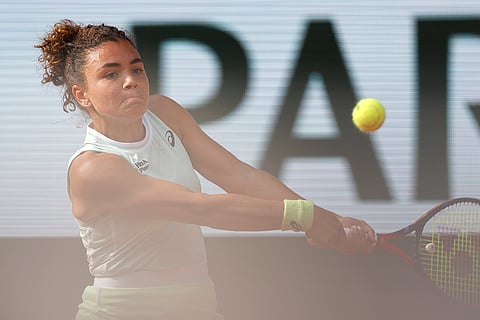 Jasmine Paolini plays a shot against Mirra Andreeva